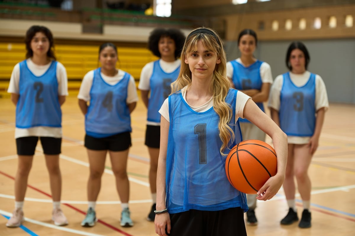 Female basketball player wearing team jersey