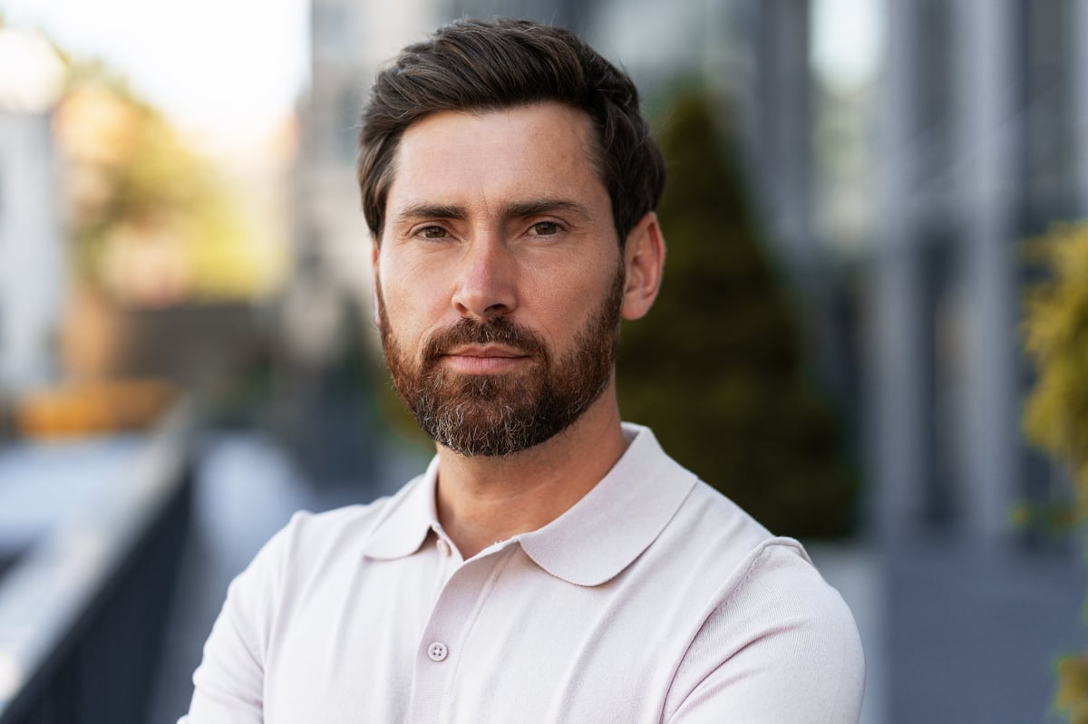 Man wearing polo shirt in professional setting